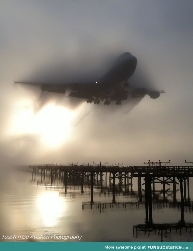 747 cutting through the fog