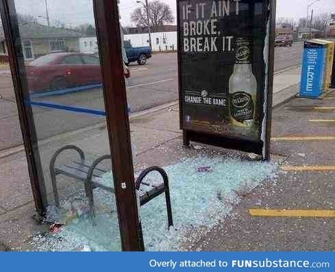 I blame the advertisement for what happened to this bus shelter