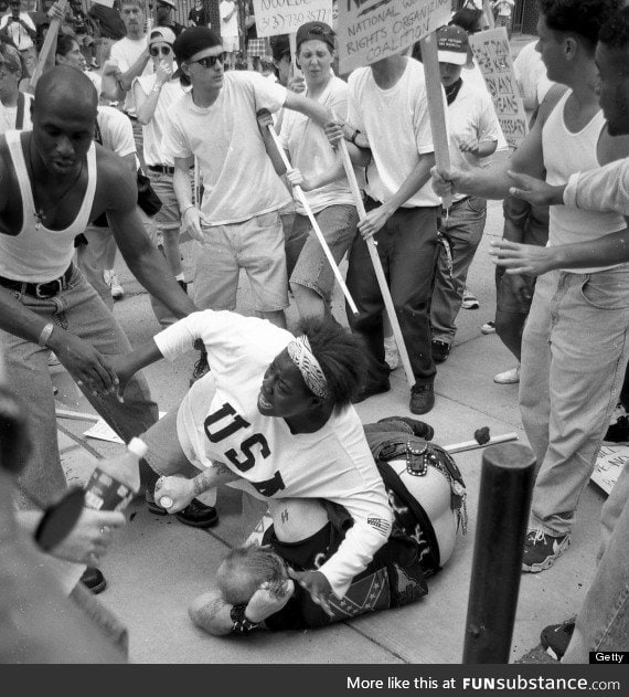 18-year-old Keshia Thomas falls on Ku Klux Klan member to protect him from a mob