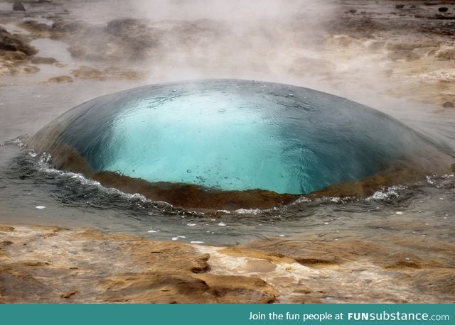 Geyser in Strokkur, Iceland seconds before eruption