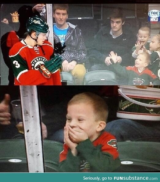 Hockey player waves at kid