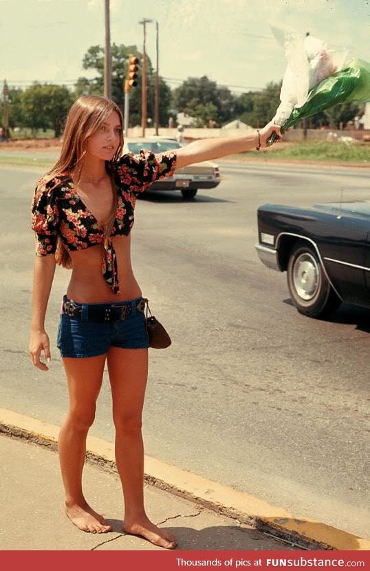 Hippie chick selling roadside flowers in Oklahoma - 1973