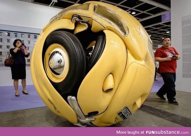 A Volkswagen Beetle compressed into a ball. From artist Ichwan Noor