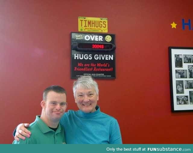 Tim Harris a restaurant owner in the US with Down Syndrome, serves food & hugs.