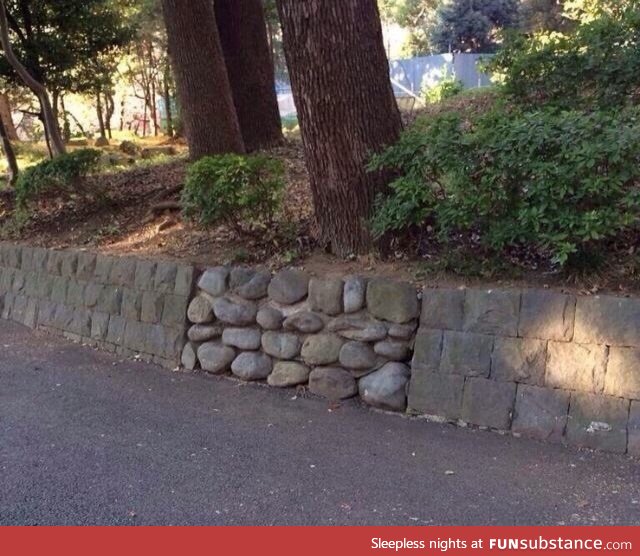 In a video game there would definitely be something hidden behind this wall