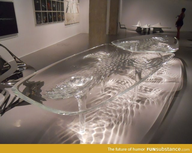 Glass table made to look like flowing water