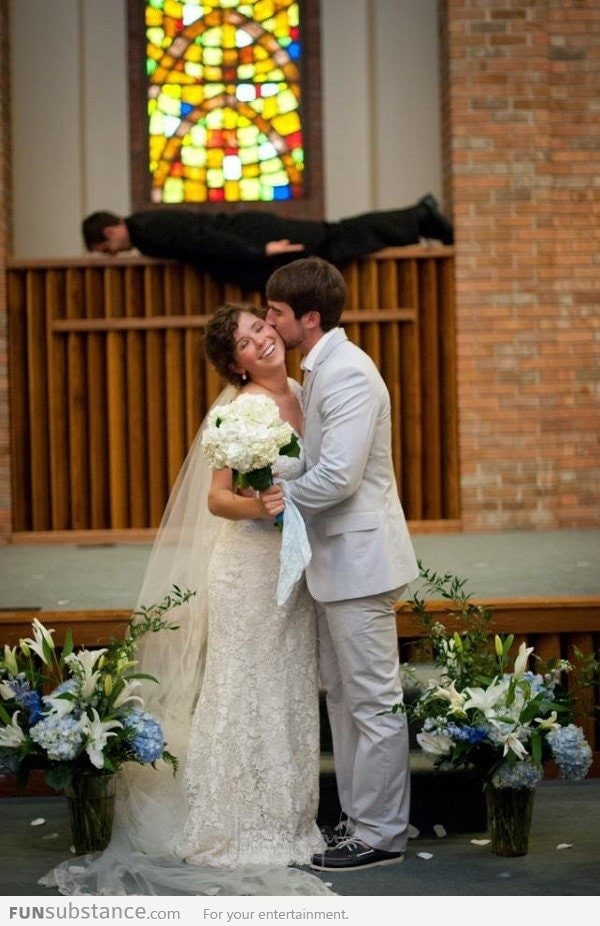 Just A Wedding Photo...with Their Pastor In The Background.