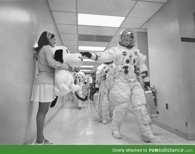 Apollo 10 commander Tom Stafford pats the nose of a giant stuffed Snoopy prior to launch