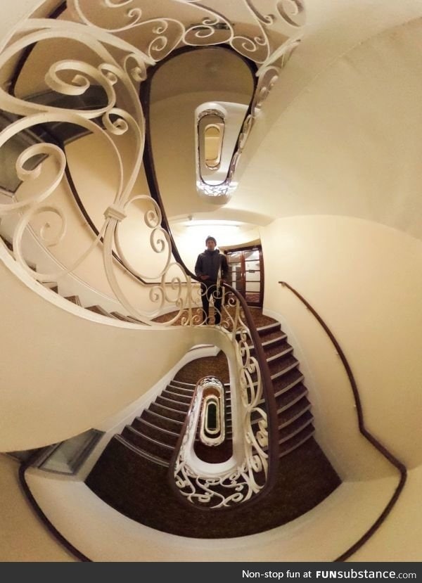 Looking up and down a stairwell at the same time