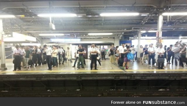 Tokyo commuters waiting for their train