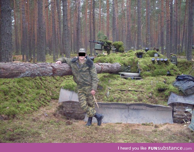 Guy leaning on normal sideways tree