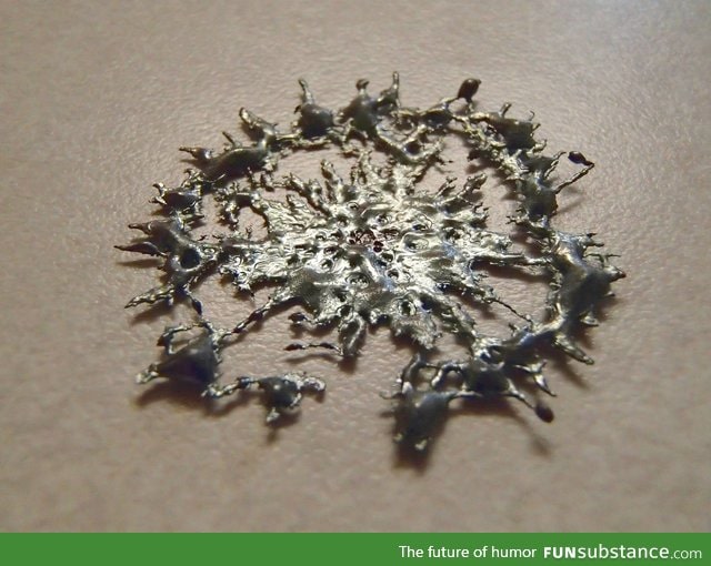 This drop of molten metal solidified right as it hit the table