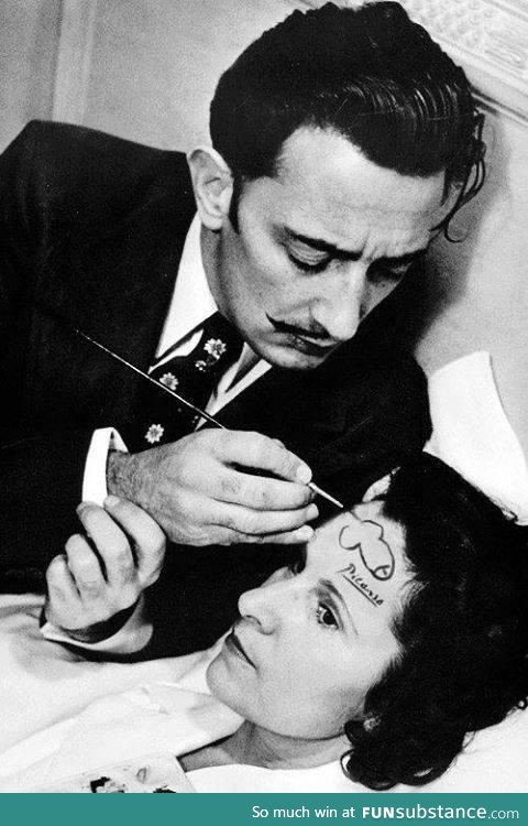 Salvador Dali drawing a pen*s on the forehead of a woman and signing it with Picasso’s