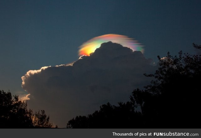 An extremely rare rainbow-colored pileus iridescent cloud over Ethiopia