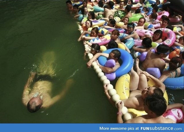 In China, You Can Pay Extra To Get in the uncrowded section of the swimming area