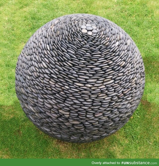 Sphere-shaped sculpture made of pebbles