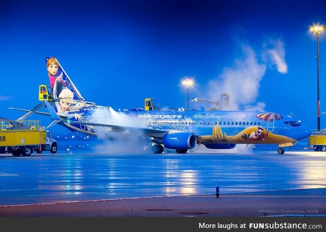 Airport ground crews de-icing a Frozen plane