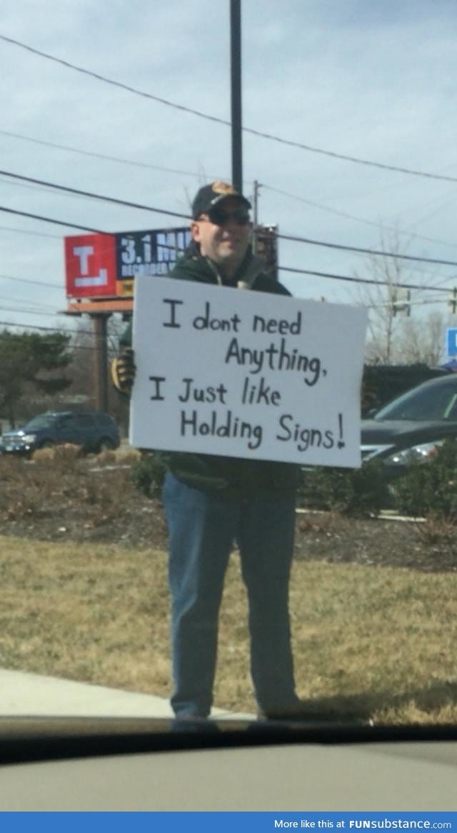 Most guys holding a sign on a street corner don't make me smile