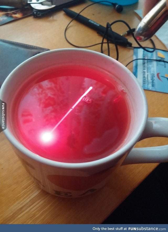 Shining a laser through tea makes the beam visible in it