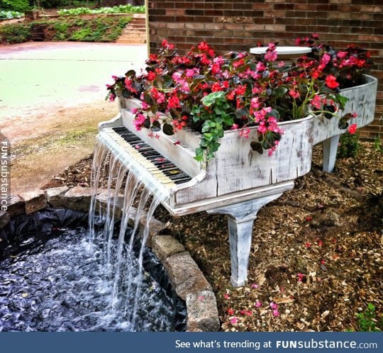 Old piano turned into a magnificent fountain