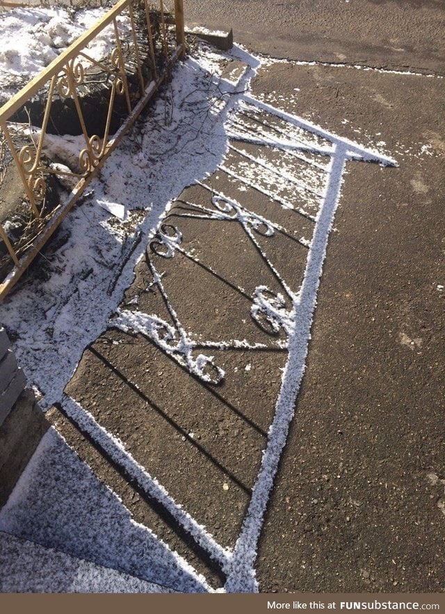 The fence's shadow prevented the snow from melting