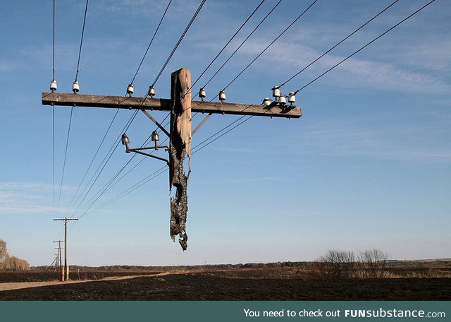 This electrical pole was left hanging after a wildfire