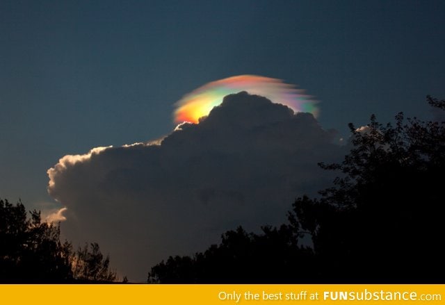 An extremely rare rainbow-colored pileus iridescent cloud over Ethiopia