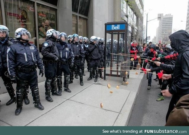 Protesters taunting police with donuts