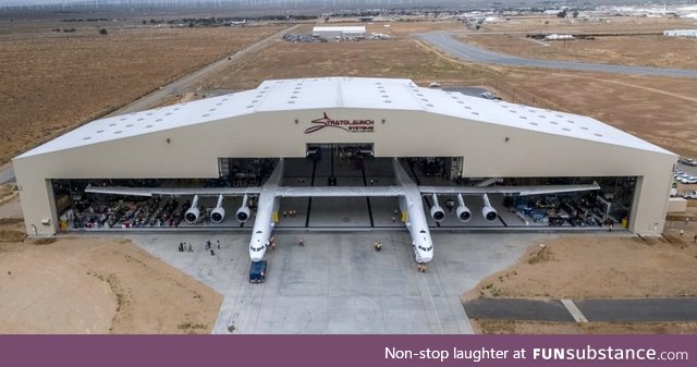 The largest aircraft in the world rolling out of it's hangar in Mojave CA