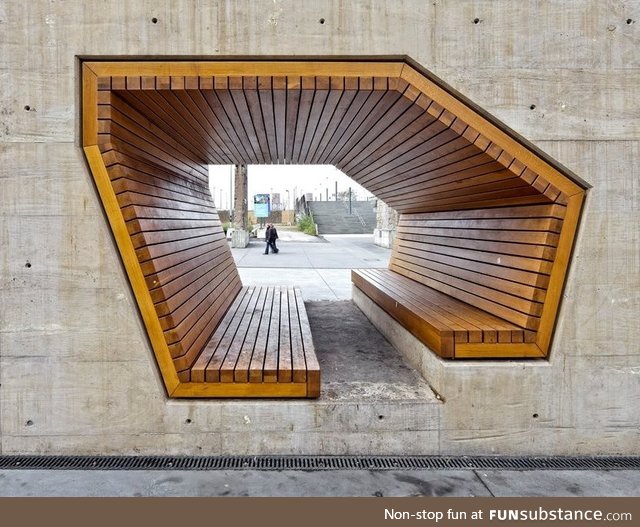 Bench through a concrete wall