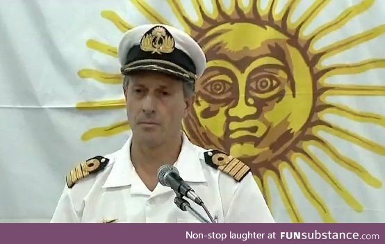 This sun giving a shoulder rub to this navy officer