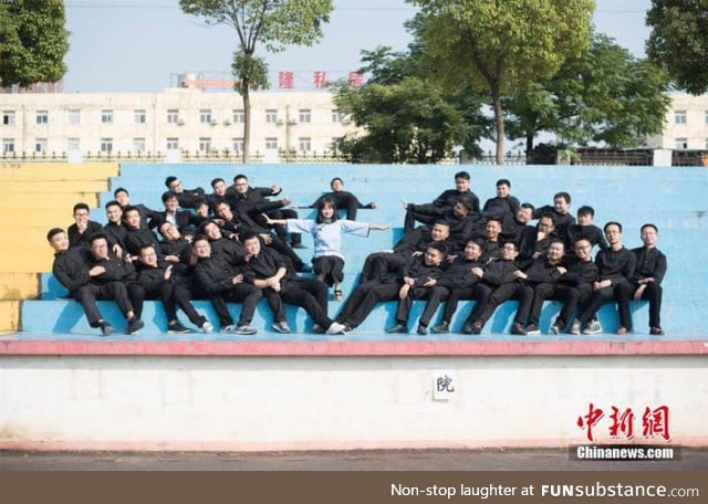 Only girl in an engineering school posing with her other classmates