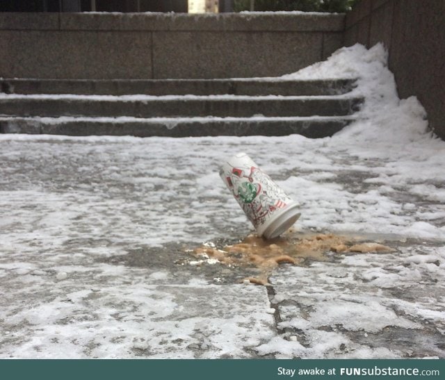 Cold day in Toronto, ON. Frozen starbucks cup on a sidewalk