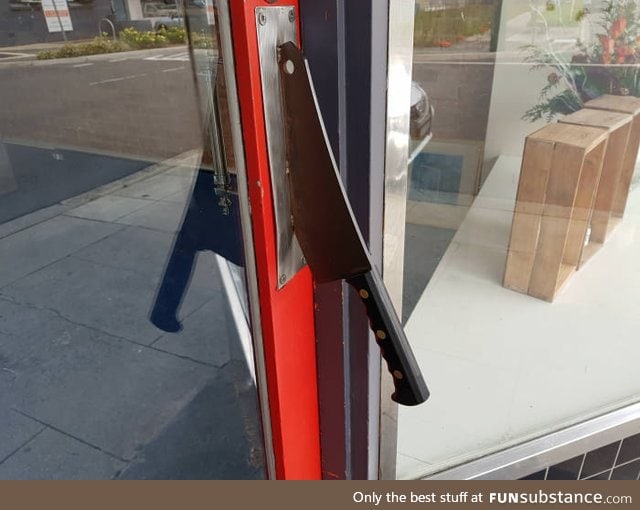 The door handle to this butcher shop