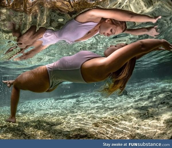 This swimmer and her reflection