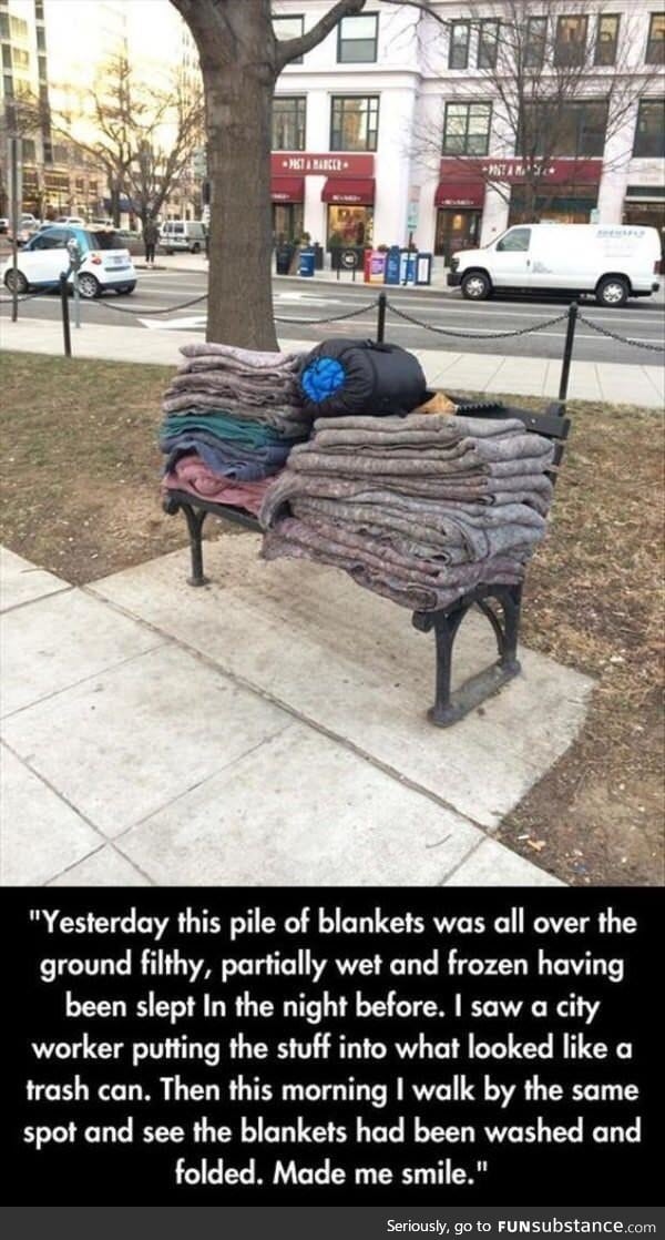 A city worker washes and folds these blankets for the homeless