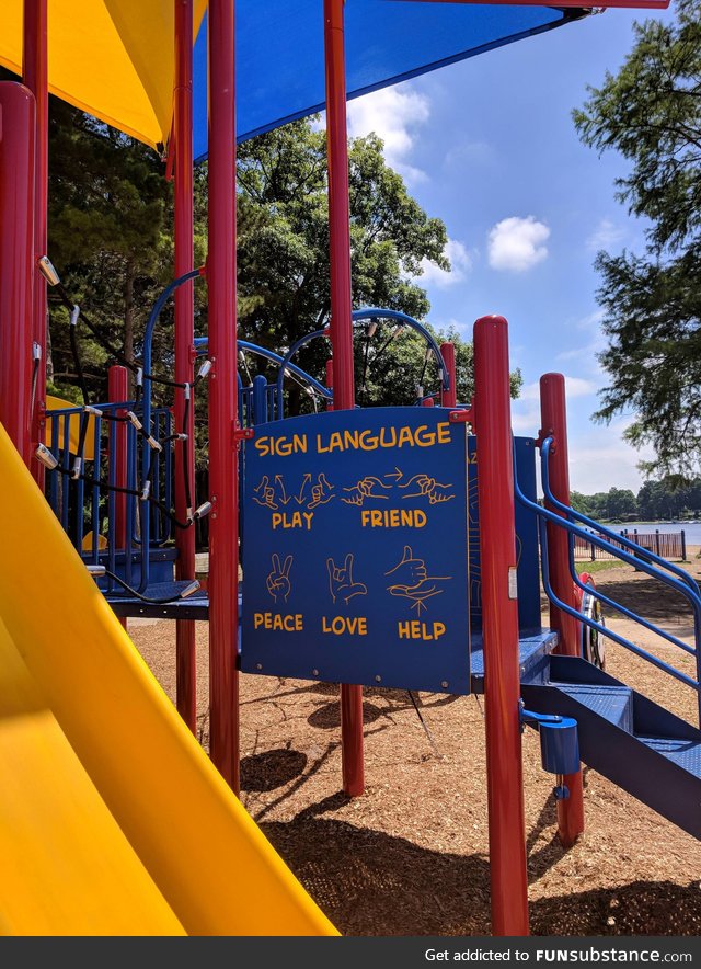 playground has a sign so hearing and deaf kids can play together