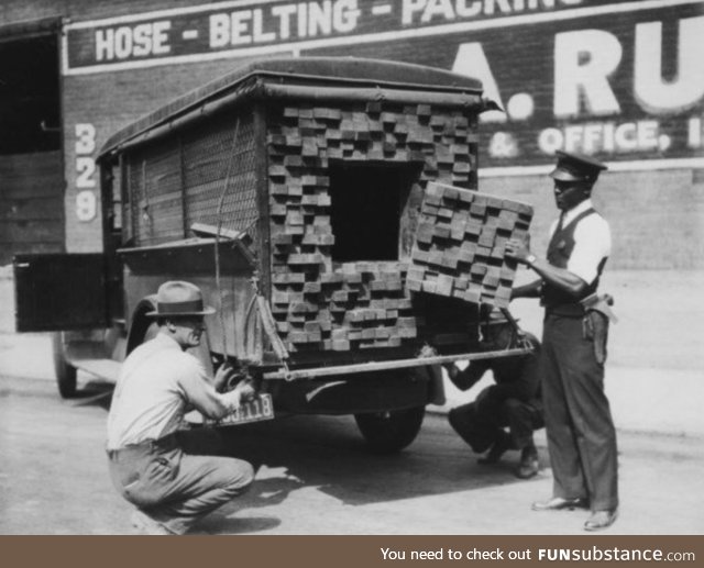 [1926] Federal agents, alerted by the smell of alcohol, inspecting a "lumber truck"