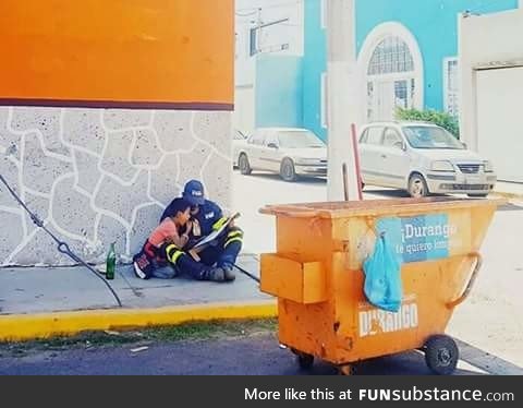 A father takes a break from his job to educate his son on the street