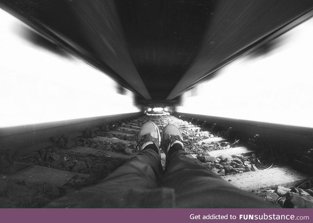 Photographer under train