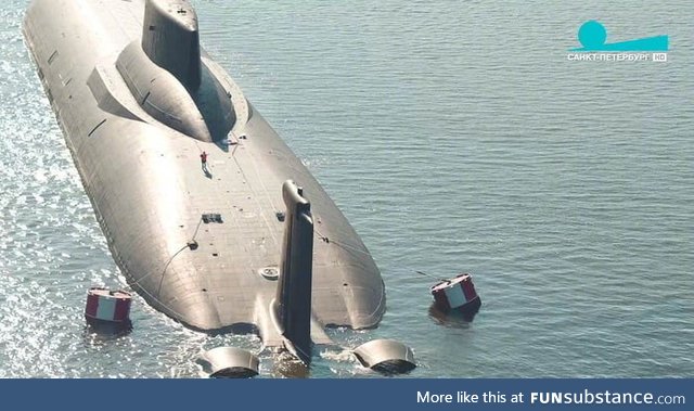 Soviet Typhoon Class, the biggest submarine ever made (there's a man on the deck)