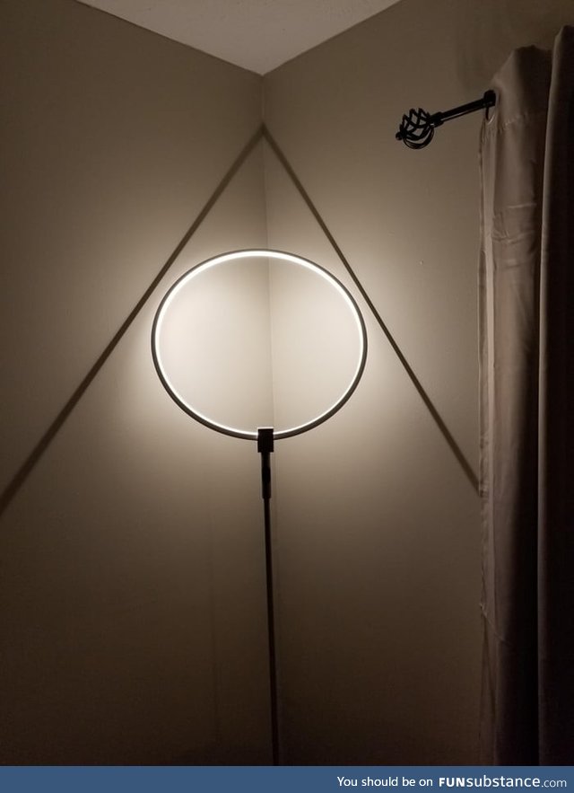 My round lamp throws a triangle shadow