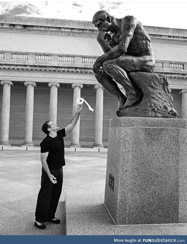 Robin Williams offering a toilet roll to ’ The Thinker’