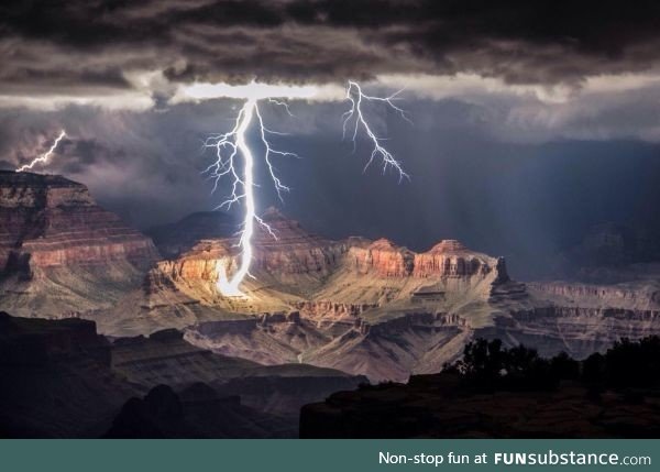 Grand Canyon getting lit only by a lightning stroke