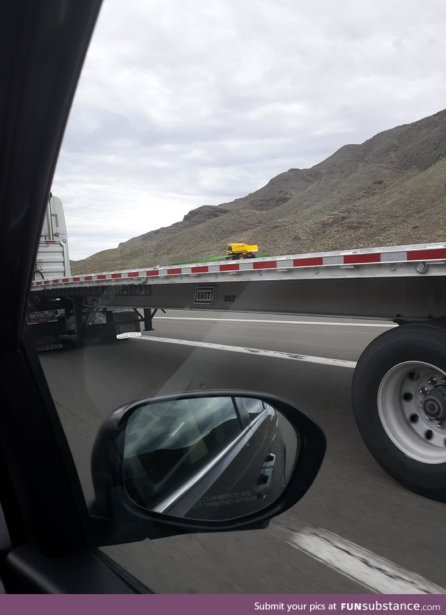 This truck carrying nothing but a toy dumptruck