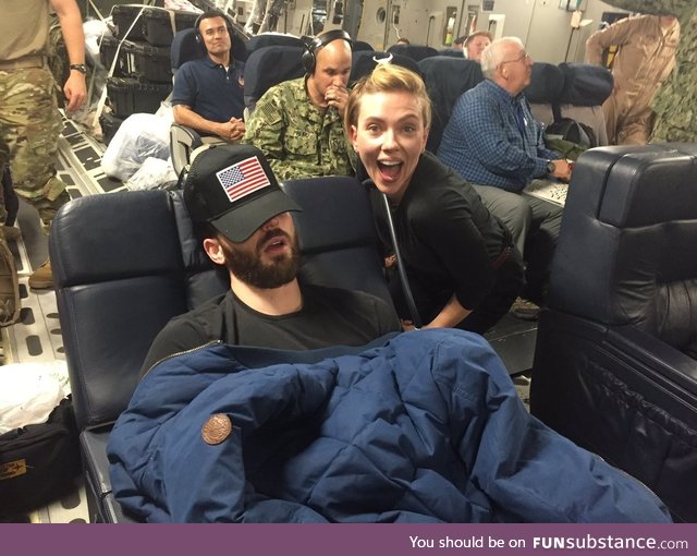 Scarlett Johansson and a sleeping Chris Evans on a USO tour