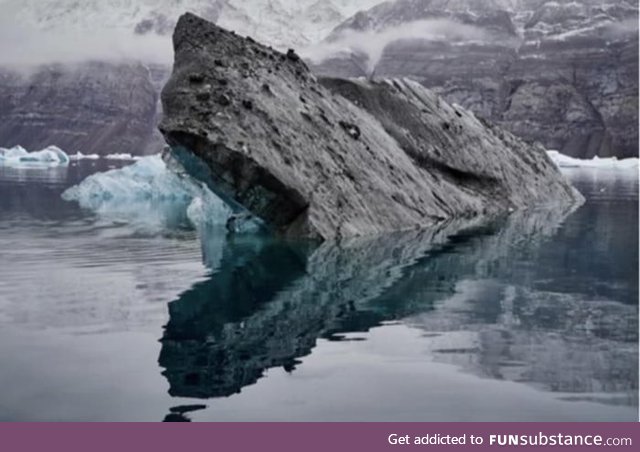 Reflection makes the rock look like a monster