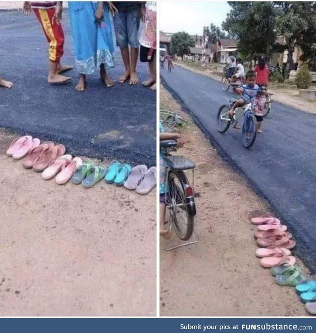 Indonesian residents walk barefoot because they do not want to get new asphalt dirty