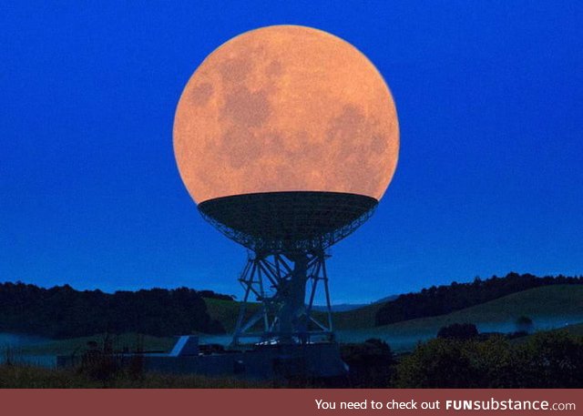 The moon positioned perfectly on top of the satellite