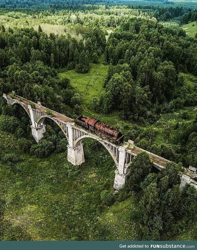 This abandoned railroad track with train still on it